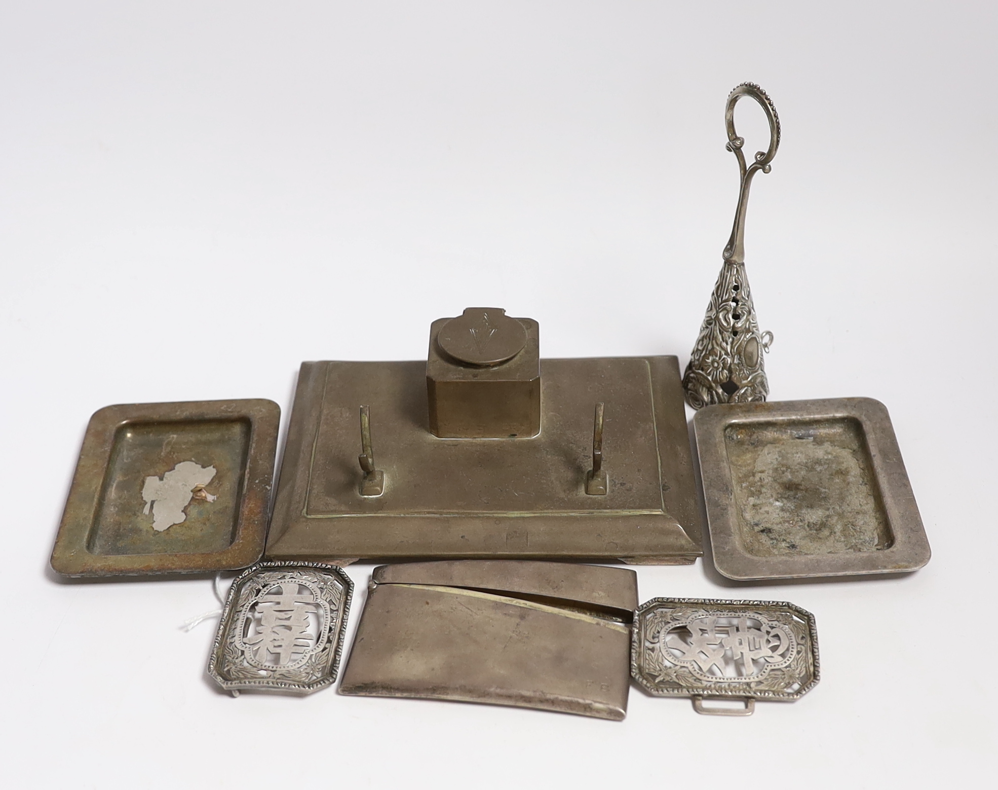 An early 20th century Chinese Export pierced white metal buckle, maker CS?, width 87mm, together with a silver plated card case, inkstand, two dishes and posy holder.